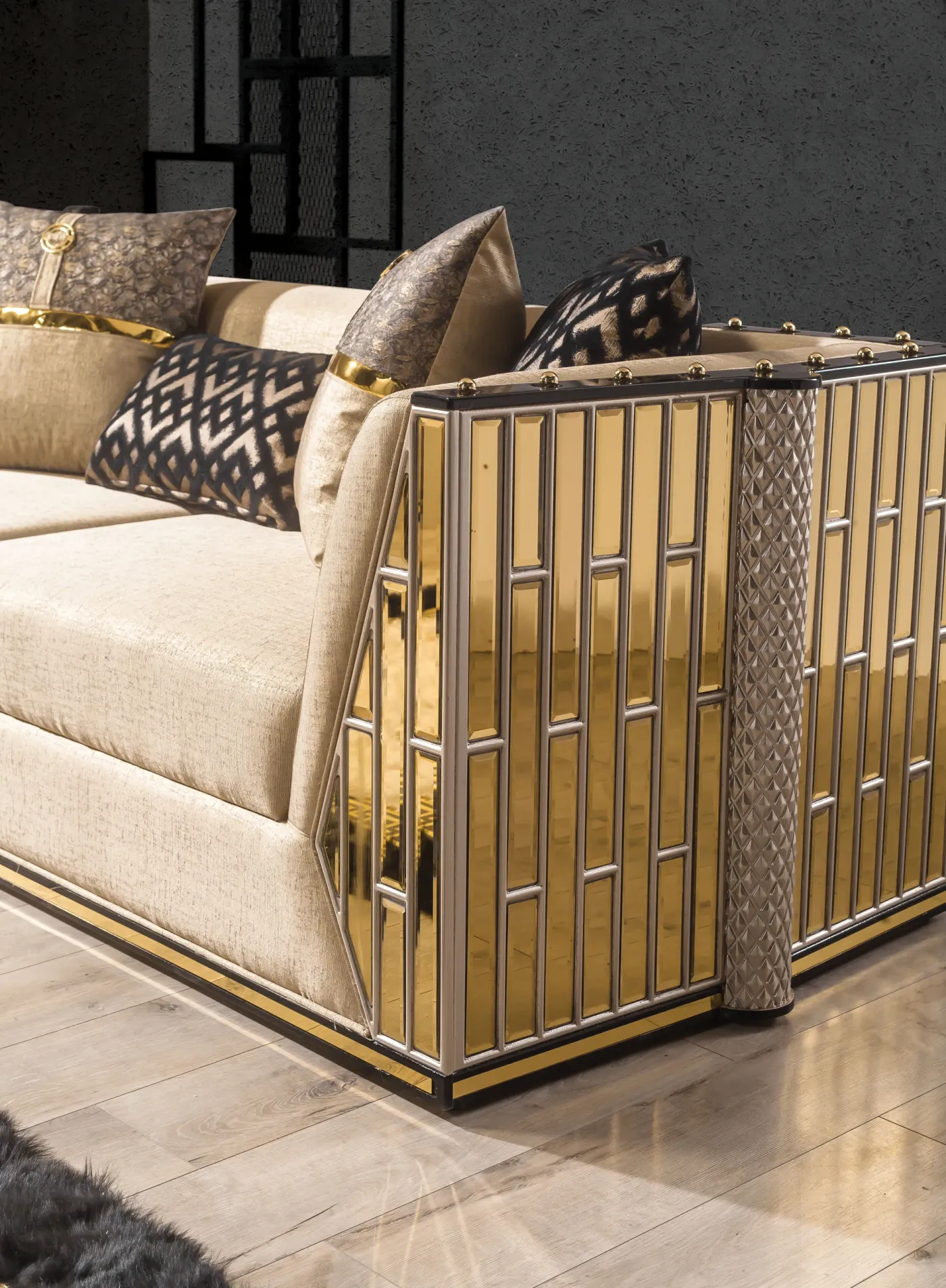 Bentley sofa from the side, showing the hand-finished gold column panel